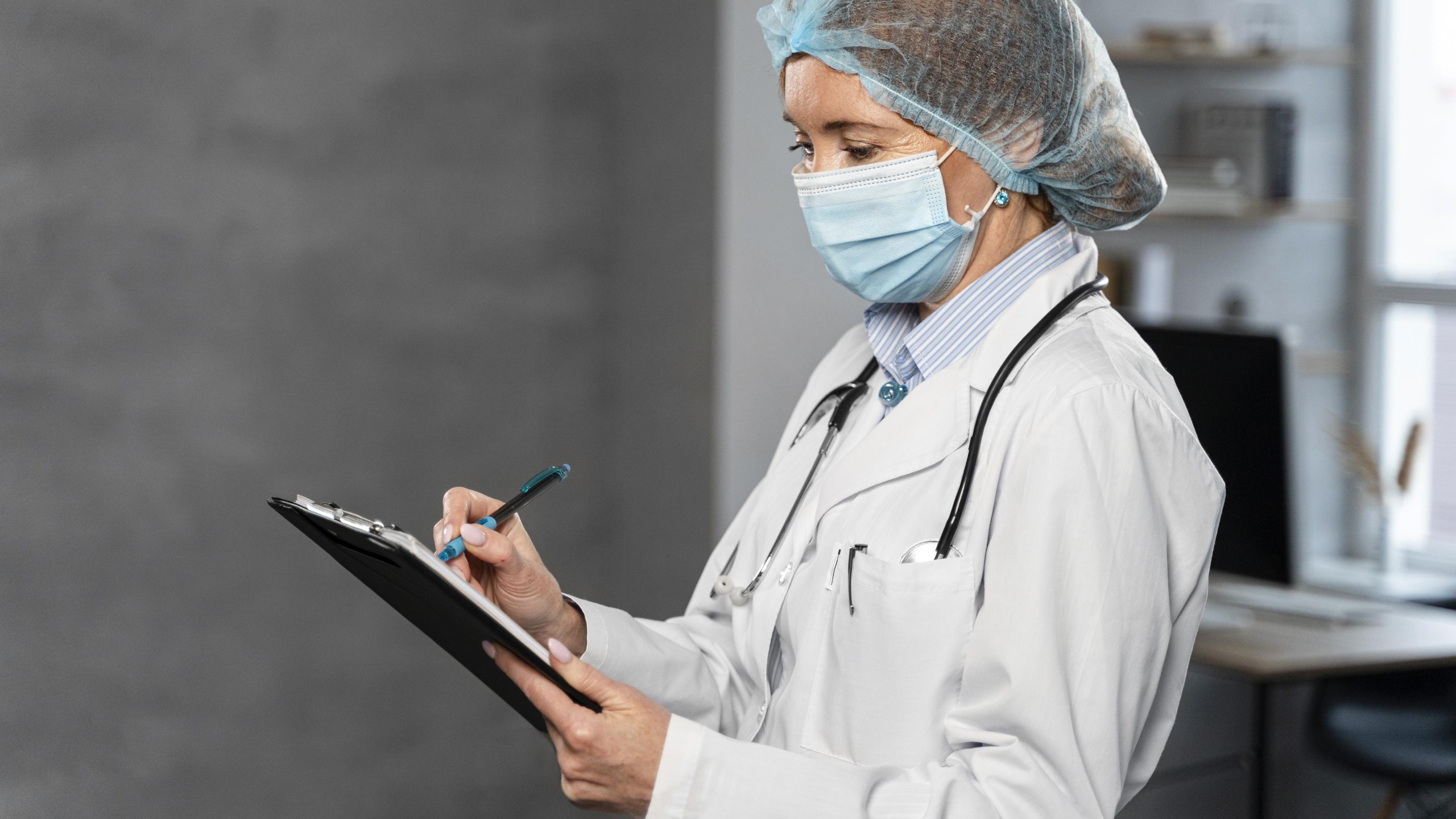 side-view-female-doctor-with-medical-mask-hairnet-holding-clipboard